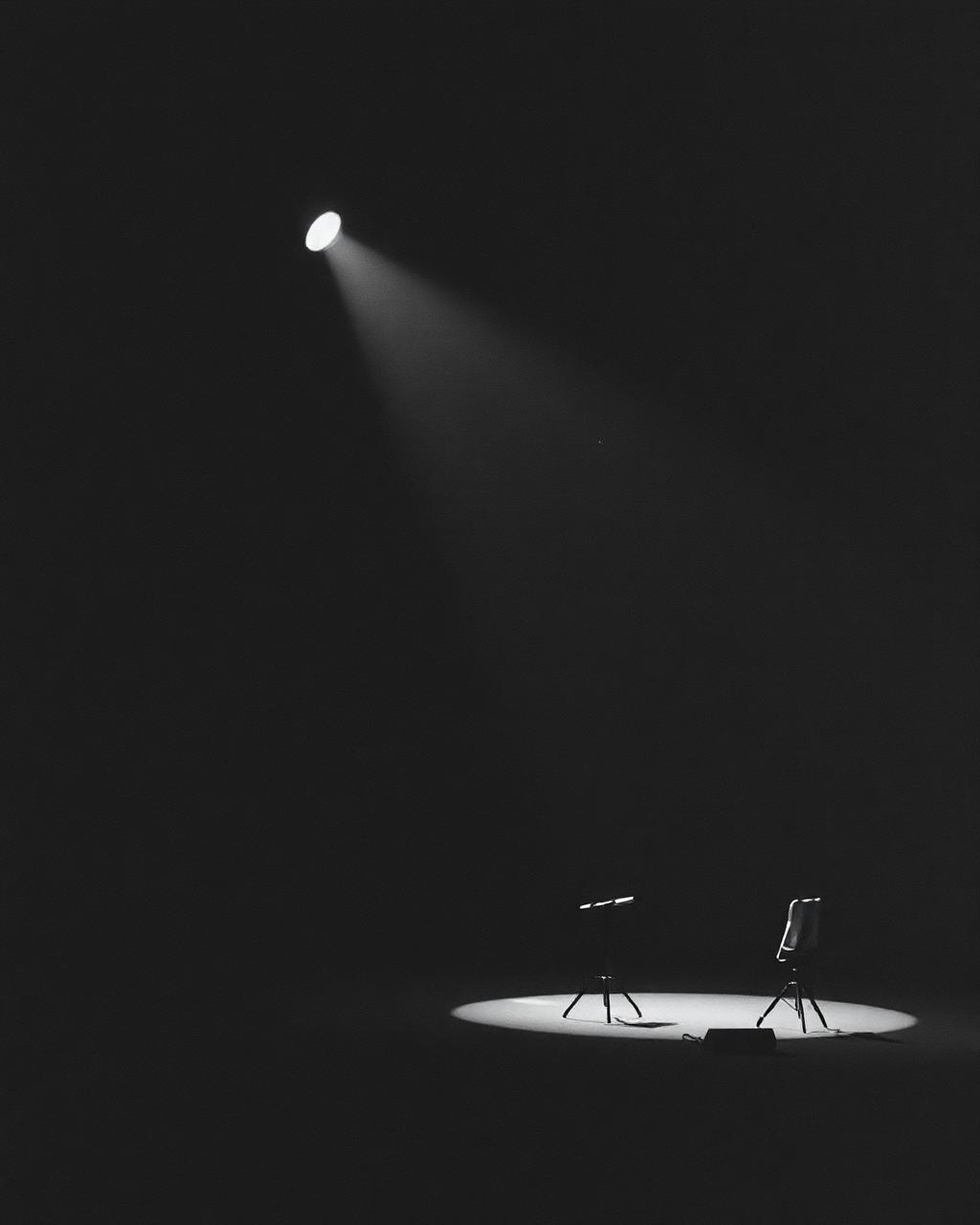 Minimal stage and lighting setup in an empty performance space